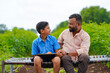 © Niks Ads - Cute indian farmer child studying with his father at home