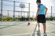 © Ladanifer - Two friends playing football, one has a leg prosthesis and is kicking a penalty.