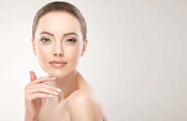 beautiful young woman with clean fresh skin . facial treatment . cosmetology , beauty and spa . skin