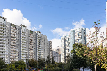 Wall Mural - municipal high-rise apartment house under blue sky