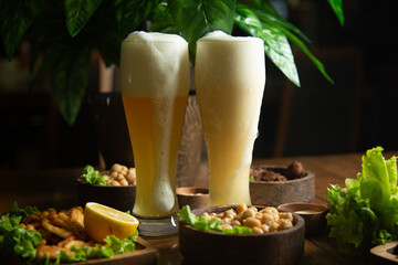 Sticker - hot meat snacks for beer served on wooden dish