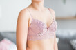 © staras - Woman in pink lace bra at home