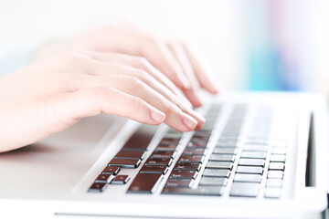 Poster - Female hands typing on laptop keyboard
