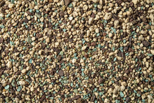 Non-organic Plant Substrate Lechuza-Pon As A Background. Soil Mix Of Pumice, Zeolites, Lava Rock And Fertilizer For Succulents And Cactus. Texture Of Houseplant Soil Substrate. Floriculture Concept.