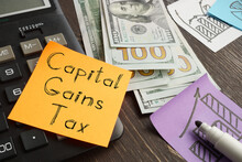 Capital gains tax is shown on the business photo using the text