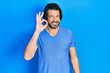 © Krakenimages.com - Middle age caucasian man wearing casual clothes smiling positive doing ok sign with hand and fingers. successful expression.