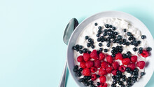 Healthy Breakfast Cottage Cheese With Sour Cream And Berries In A Blue Plate On A Light Background. Healthy Food Berries And Cottage Cheese In A Plate A Place For Text