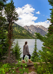 Poster - Beautiful Caucasian woman resting in Jenny Lake at Grand Teton National Park, USA