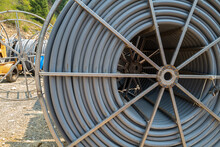 Spool Of Conduit At A Worksite By The Side Of The Road