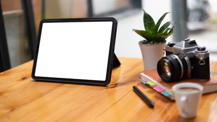 Mock up of blank screen laptop on the desk. Work space Mock up white tabletop vintage camera and pencils on white wood desk with copy space for products display montage. work space concept.