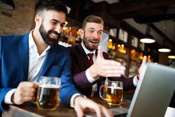 Canvas Print - Handsome two businessmen have a meeting in a restaurant