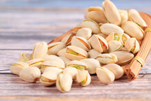 The Pistachios Are On The Wooden Board