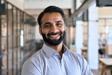 happy smiling bearded indian business man small business owner, company leader or sales manager, mal