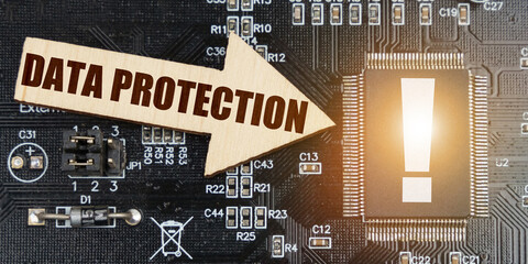 Poster - On the computer board, a microcircuit with an exclamation mark and an arrow with the inscription - Data protection