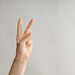 © Alexander - Hand gestures, Two thumbs up, a victory gesture. Women's hand