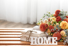 Autumn Composition With A Bouquet Of Chrysanthemums And Decorative Word Home.
