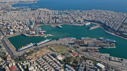 Wall Mural - Aerial drone photo of famous and busy port of Piraeus where passenger ferries travel to Aegean destination islands as seen from high altitude , Attica, Greece