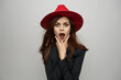 © VICHIZH - woman wearing metal witch costume red hat mystic holiday