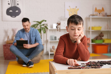 Poster - Little boy with autism spectrum disorder at psychologist's office