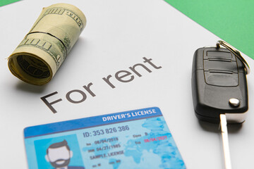 Poster - Paper with text FOR RENT, car key, driving license and money on green background, closeup