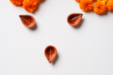 Sticker - Traditional oil lamps with flower decoration for indian festival diwali.