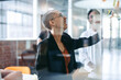 © Jacob Lund - Happy young businesswoman sharing her ideas with her team in an