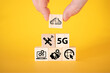© beast01 - Data transfer icons on wooden cubes, yellow background.