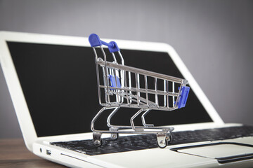 Shopping cart on the laptop keyboard.