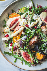 Canvas Print - Warm autumn quinoa salad with baked vegetables, figs, feta cheese and pomegranate.