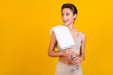 Poster - Photo of cute lady hold water bottle towel look empty space wear grey cropped top isolated yellow color background