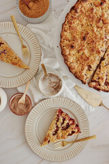 Poster - Top view of the slices of a delicious homemade crumble pie with berries on round ceramic plates