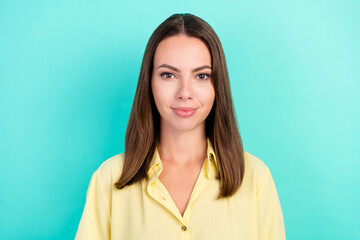 Wall Mural - Photo of optimistic millennial brunette lady wear yellow blouse isolated on teal color background