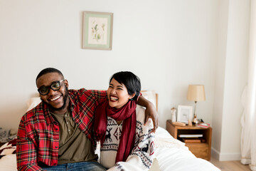 Cheerful couple enjoying Christmas holiday