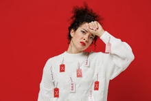Young Sick Ill Tred Exhausted Female Costumer Woman 20s Wear White Knitted Sweater With Tags Sale In Store Showroom Put Hand On Forehead Have Headache Isolated On Plain Red Background Studio Portrait.