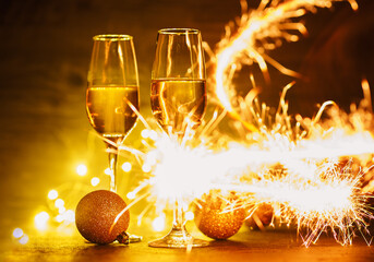 Wall Mural - Two glasses of champagne with sparklers. Festive Christmas Party