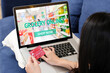 © mangpor2004 - Woman hand holding credit card and using laptop computer with grocery online shopping over blur supermarket on screen background, business and technology, lifestyle concept