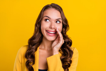 Poster - Portrait of attractive trendy cheerful girlish wavy-haired woman saying advert idea isolated over bright yellow color background