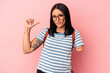 Young caucasian student woman with one arm isolated on pink background feels proud and self confident, example to follow.