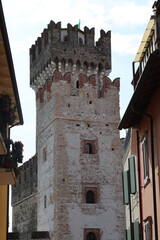 Sticker - Vertical shot of the Rocca Scaligera in a historic village Desenzano del Garda, Brescia, Italy