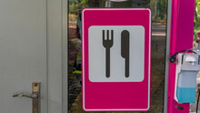 Cheerful Pink Road Sign Restaurant. Road Sign Signaling Food Services In Public Park.