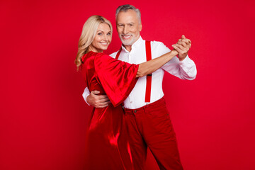 Photo of cheerful husband wife enjoy event romantic xmas vintage outfit dress suspenders festive isolated over red color background