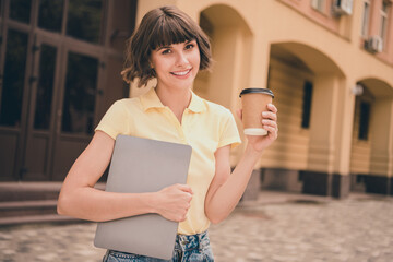 Canvas Print - Photo of charming brunette young woman lady hold hands tea cup computer outside outdoors city town