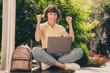 Poster - Full length photo of cool young brunette lady look laptop wear t-shirt jeans footwear outside in park