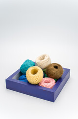 Sticker - blue wooden box with multicolored  decoration yarn with text space