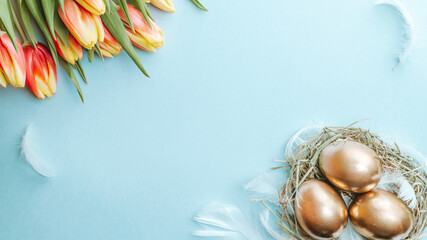 Wall Mural - Egg color. Happy Easter decoration: golden colour eggs in basket with spring tulips, white feathers on pastel blue background. Foil minimalist egg design, modern top view template.