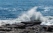 Wave From The Atlantic Ocean Crashing On The Rocks On The Coast Of Maine.