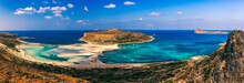 Balos Lagoon And Gramvousa Island On Crete With Seagulls Flying Over, Greece. Cap Tigani In The Center. Balos Beach On Crete Island, Greece. Crystal Clear Water Of Balos Beach.