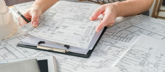 Wall Mural - Architect works remotely from home in quarantine, lockdown covid 19 coronavirus. Remote work, stay home, new normality, social distance. Architect design working drawing sketch plans blueprints