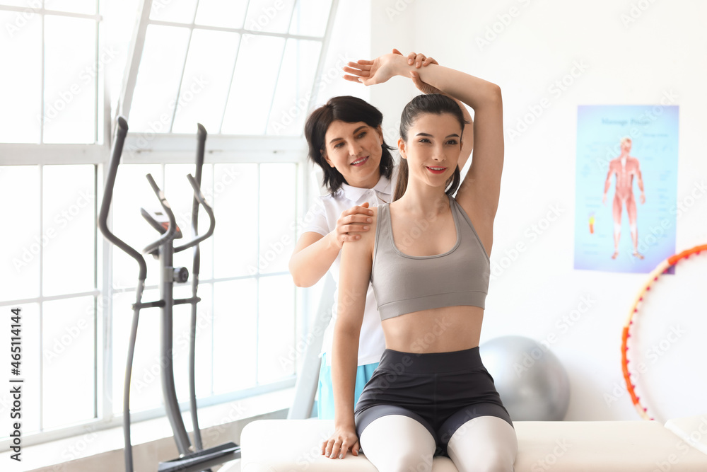 Young woman having therapy in rehabilitation center