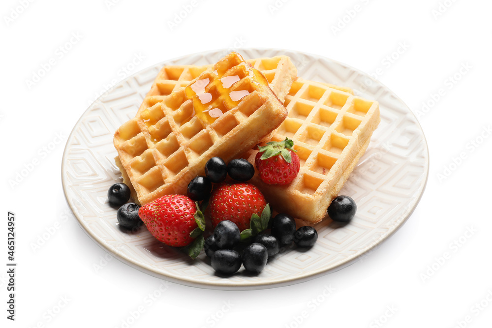 Plate of tasty Belgian Waffles with berries on white background